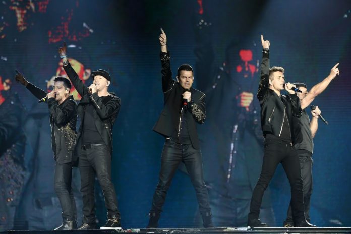 Jonathan Knight, Donnie Wahlberg, Jordan Knight, Joey McIntyre, and Danny Wood of New Kids on the Block on The Total Package Tour, Uniondale in 2017.