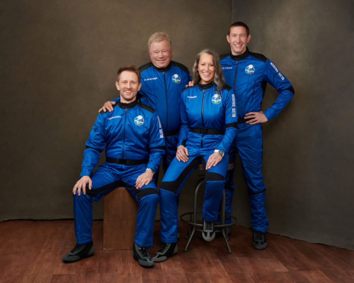 Actor William Shatner with Audrey Powers, Blue Origin's Vice President of Mission & Flight Operations, and crewmates Chris Boshuizen and Glen de Vries.